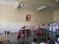 H.H. Swamiji partaking Bhiksha along with Swami Brahmanand Saraswati and Yuvadhara, Prarthana Varga and other Sadhaka-s